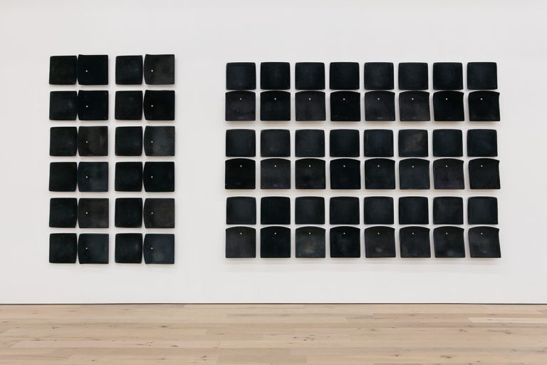 Image of Jessica Vaughn's "After Willis" showing used bus seats mounted to a gallery wall