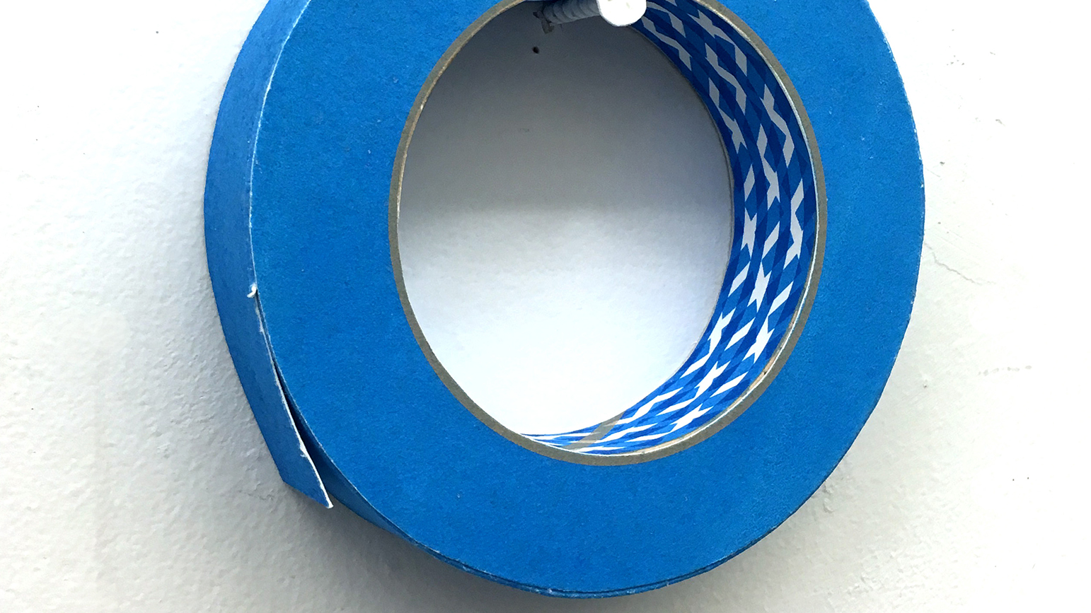 Image of a roll of blue painter's tape constructed from paper