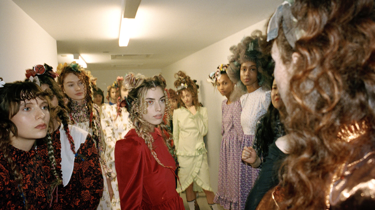 Behind-the-scenes photograph of models at a fashion show
