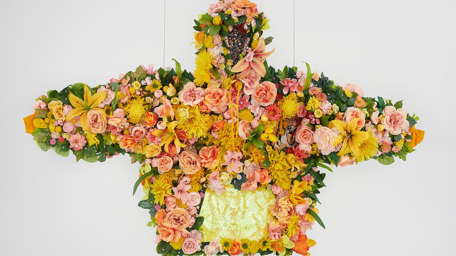 Sculpture of a hoodie covered in flowers and rhinestones