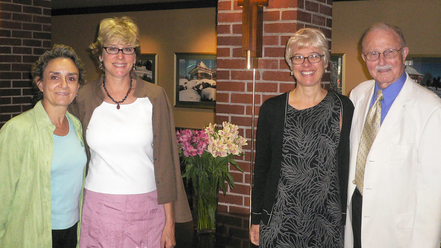 Portrait of four people standing: Dena Holland, Mary Weidner, Susanne Slavick, and Orville Winsand