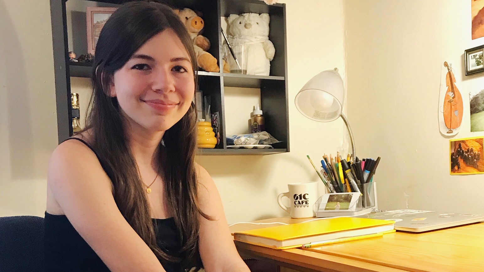 Portrait of Michelle Janco sitting at her desk