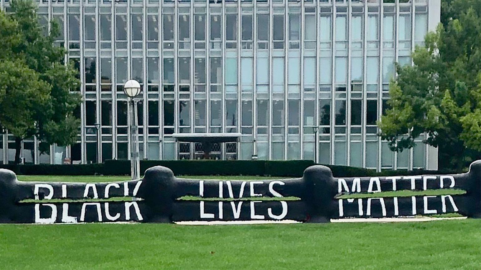 Photograph of The Fence at CMU with the text Black Lives Matter painted on it